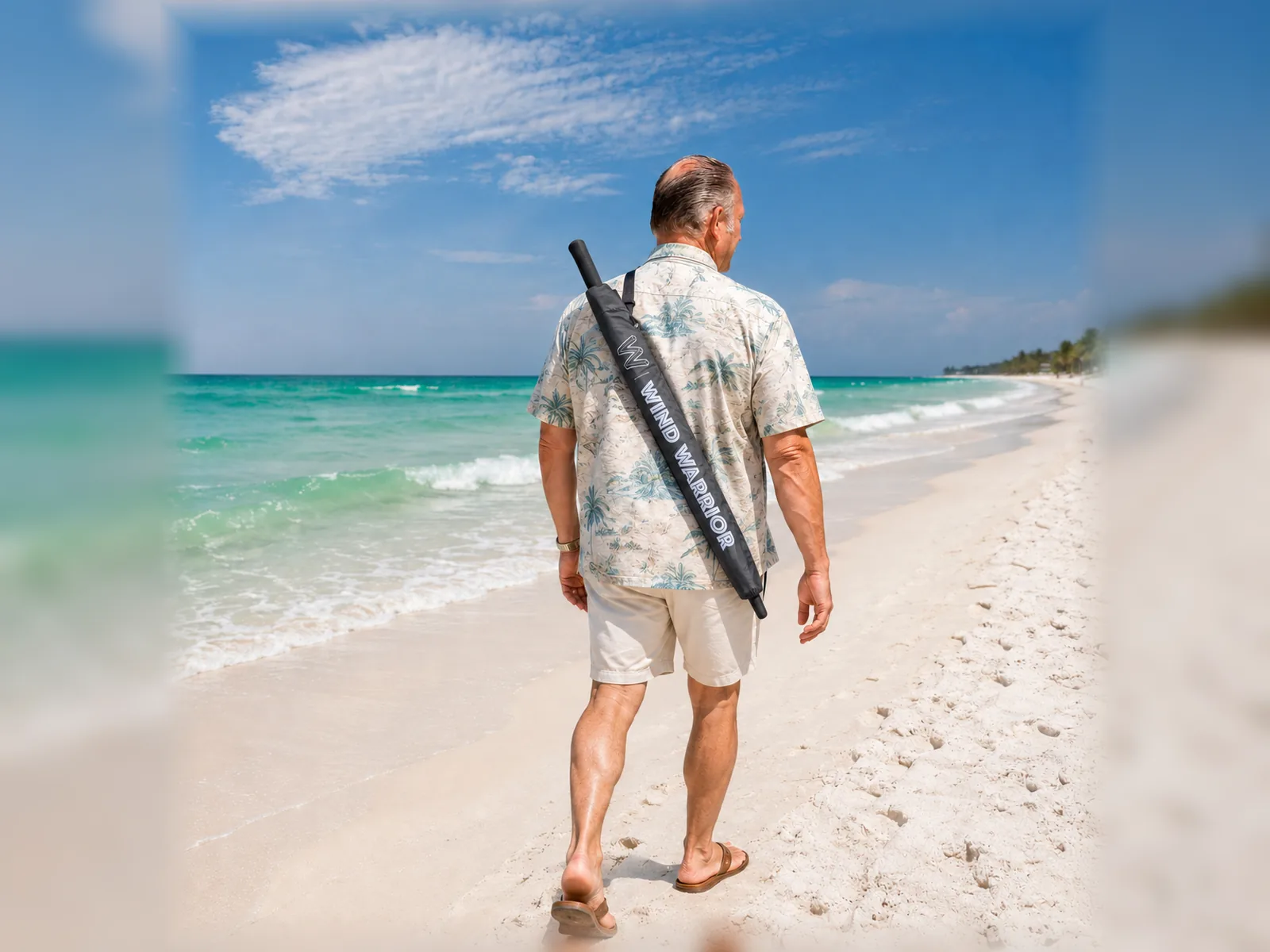 Wind Warrior umbrella carried outdoors near the water